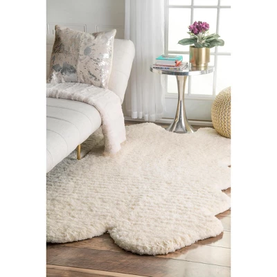 NuLOOM Hand Tufted Sexto Pelt Faux Sheepskin Area Rug, Shaped 4' 9" X 6', Natural 1 NuLOOM Hand Tufted Sexto Pelt Faux Sheepskin Area Rug, Shaped 4' 9" X 6', Natural