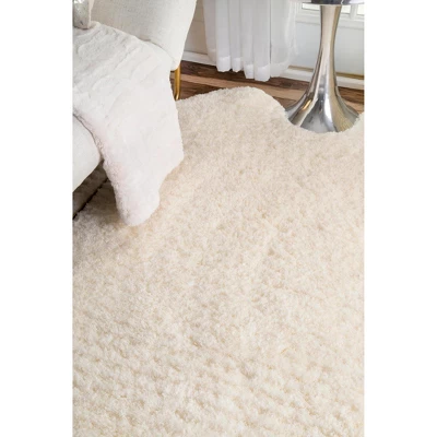 NuLOOM Hand Tufted Sexto Pelt Faux Sheepskin Area Rug, Shaped 4' 9" X 6', Natural 3 NuLOOM Hand Tufted Sexto Pelt Faux Sheepskin Area Rug, Shaped 4' 9" X 6', Natural - Image 3